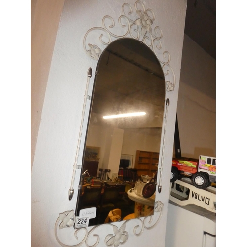 224 - A vintage metal framed hall mirror.