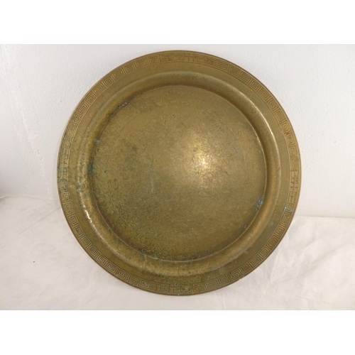 246 - A decorative antique brass tray.