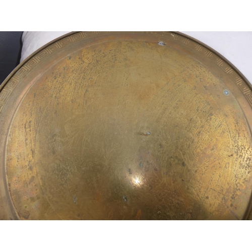 246 - A decorative antique brass tray.