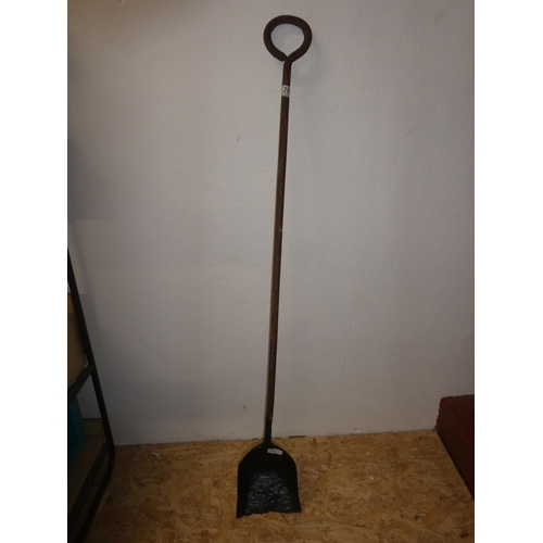 251 - An antique shovel for a steam train.