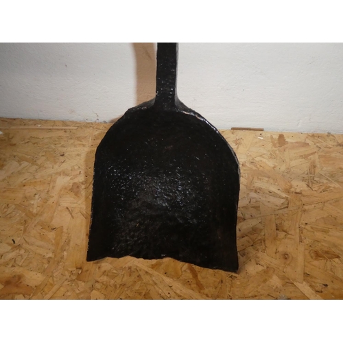 251 - An antique shovel for a steam train.