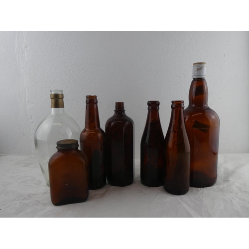 253 - A collection of vintage bottles to include Thomas Moore & Co, Armagh.