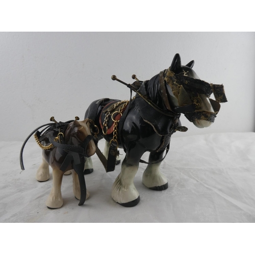 254 - Two ceramic shire horses.