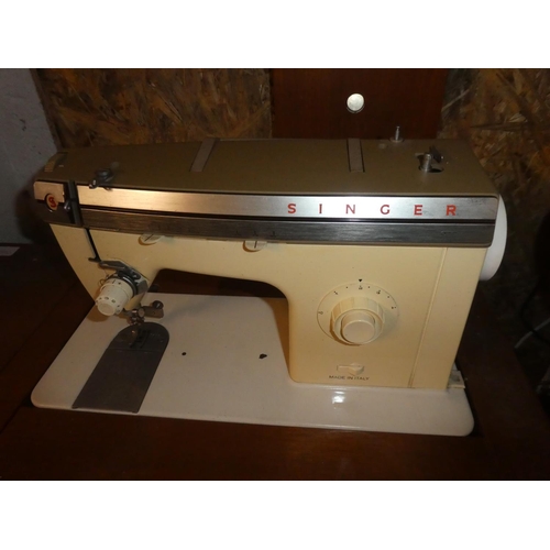 260 - A vintage Singer sewing machine and work table.