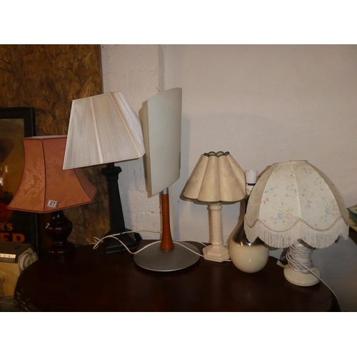 273 - A large assortment of table lamps and shades.