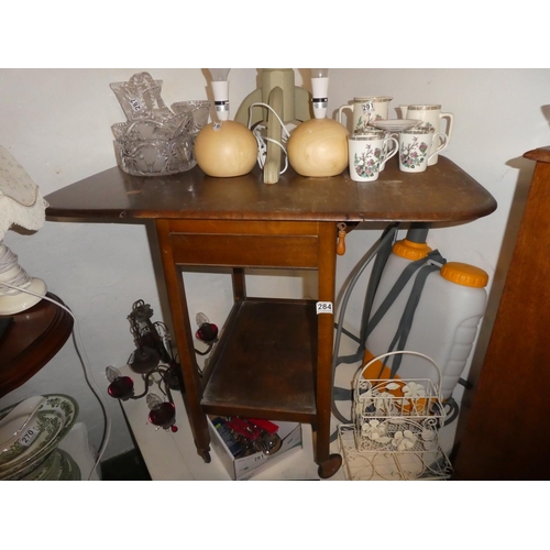 284 - A vintage drop leaf table with side drawer.