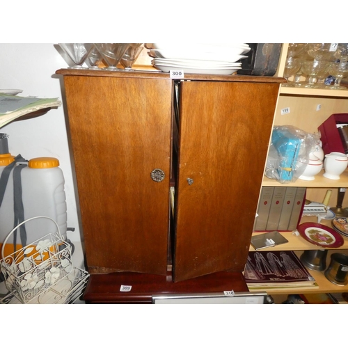 300 - A vintage wooden two door record cabinet.