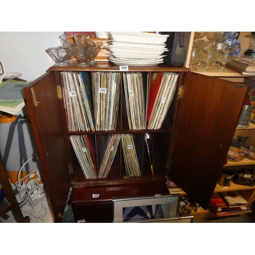 300 - A vintage wooden two door record cabinet.