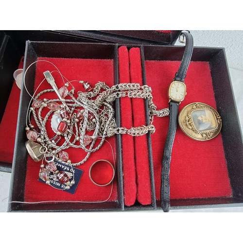 83 - A jewellery box with contents.