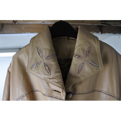 615 - A vintage leather coat by design label, 'Ross La Vie'.