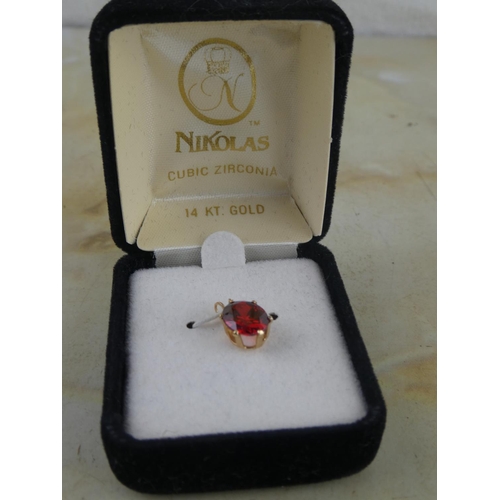 128 - A Nikolas 14ct Gold cubic zirconia pendants.