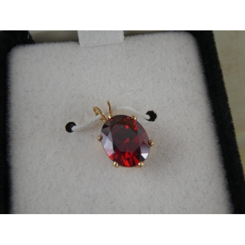 128 - A Nikolas 14ct Gold cubic zirconia pendants.