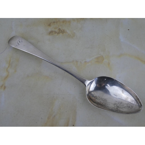 133 - A large antique/ Georgian Scottish silver serving spoon, crested with the letter 'H'.