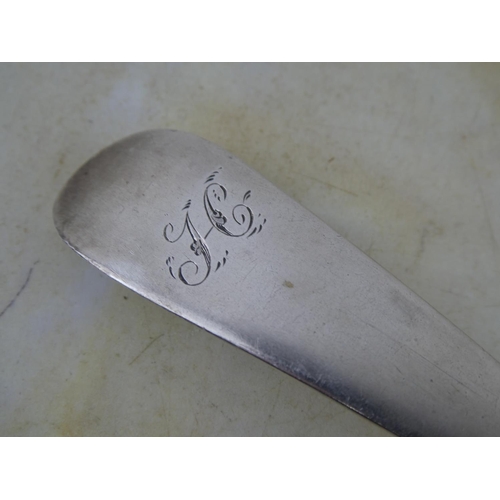 133 - A large antique/ Georgian Scottish silver serving spoon, crested with the letter 'H'.