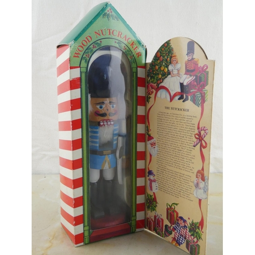 139 - A vintage wooden nutcracker figurine in its original box.