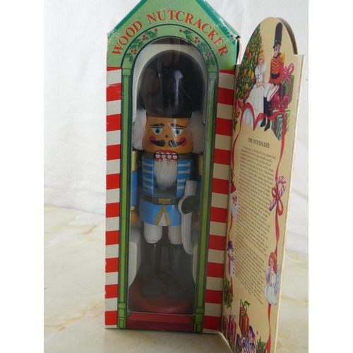 139 - A vintage wooden nutcracker figurine in its original box.