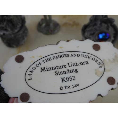 147 - A collection of Tudor Mint figurines and more.