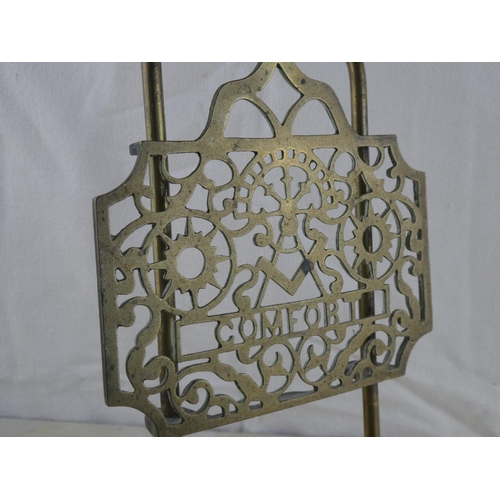 151 - An antique brass 'Masonic Comfort' fireplace trivet stand.