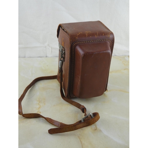 152 - A vintage Kodak Reflex camera in leather case.