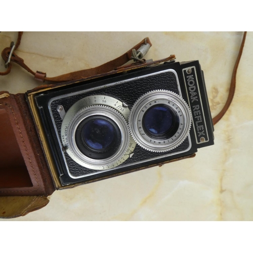 152 - A vintage Kodak Reflex camera in leather case.