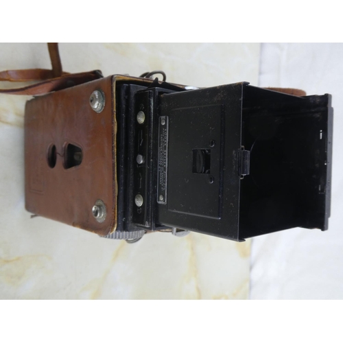 152 - A vintage Kodak Reflex camera in leather case.