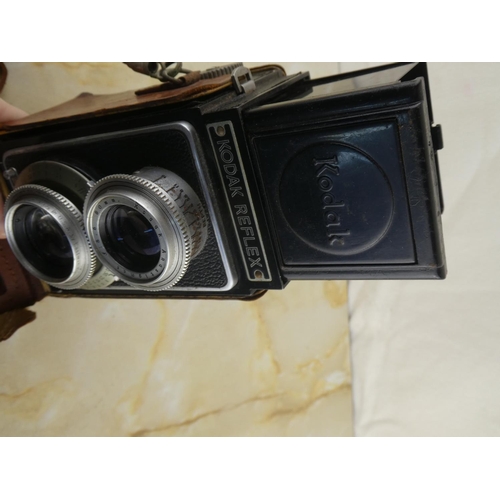 152 - A vintage Kodak Reflex camera in leather case.