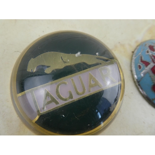 159 - 2 vintage car badges to include Triumph & Jaguar.