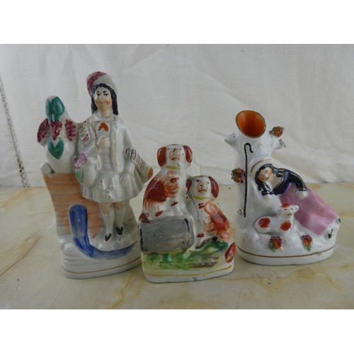 160 - A collection of three Staffordshire figurines.