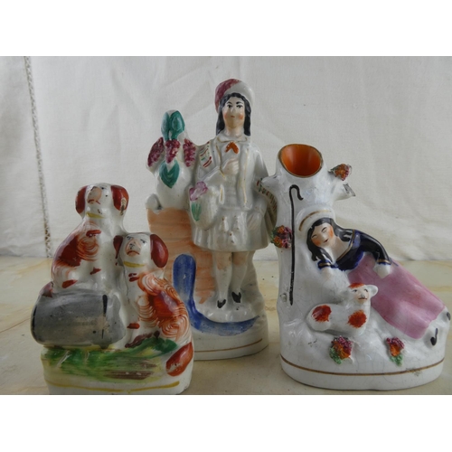 160 - A collection of three Staffordshire figurines.