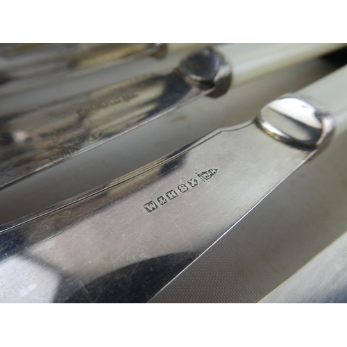 161 - A cased set of silver plated pastry knives and forks.