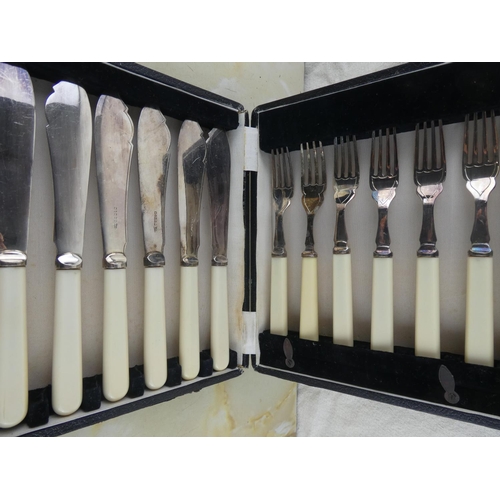 161 - A cased set of silver plated pastry knives and forks.