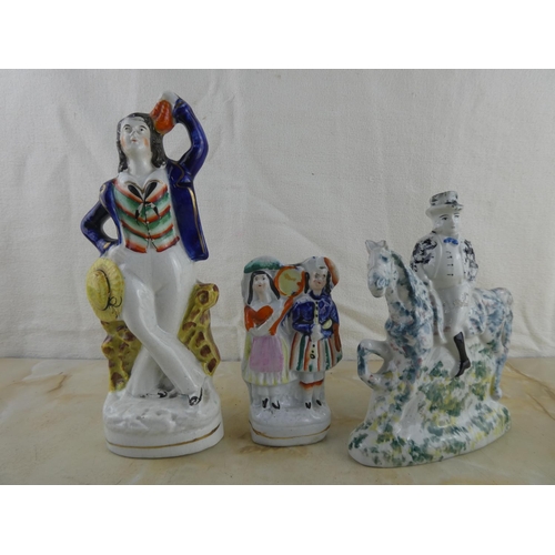 162 - A collection of three Staffordshire figurines.