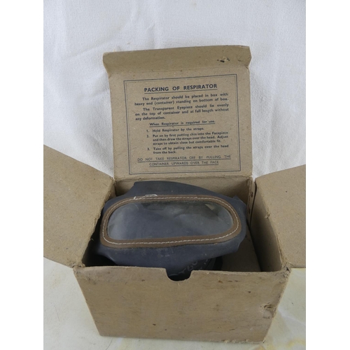 164 - An antique gas mask dated 26 July 1937 and original box.