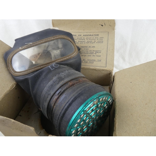 164 - An antique gas mask dated 26 July 1937 and original box.