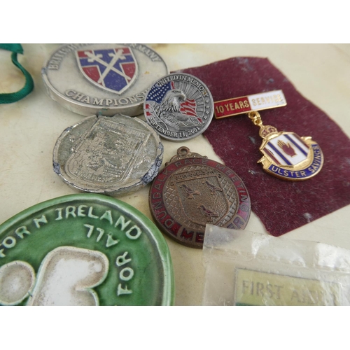 174 - An assorted lot of medals, badges and more.