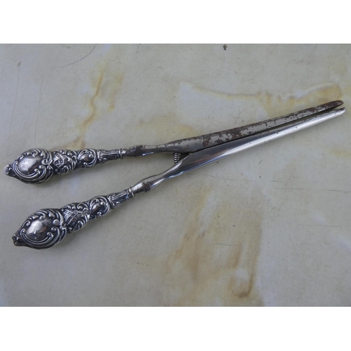 177 - A pair of Sterling Silver handled glove stretchers.