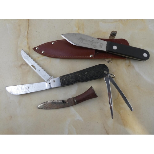 180 - A collection of three various knives to include Plummet Major throwing knife & more.