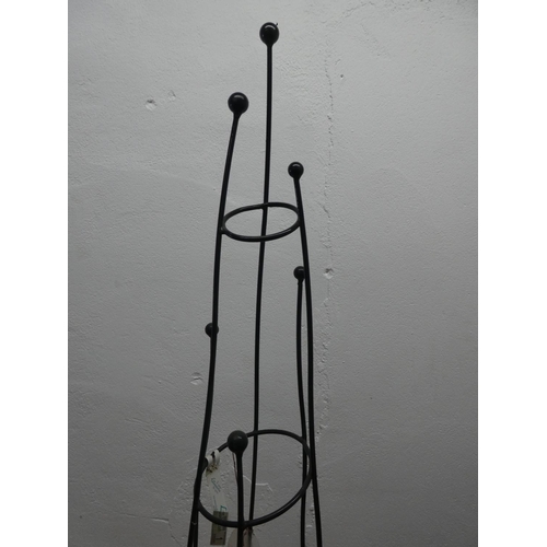 1 - A metal garden plant support.