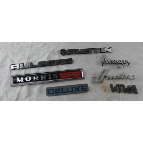 102 - A collection of car badges to include Avenger, Morris 1300, Allegro, Viva, Deluxe, Austin, Hunter.