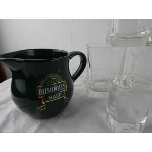 103 - An assortment of glass ware and a jug relating to the Old Bushmills Distillery.