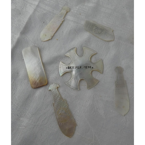 105 - A collection of antique Mother of Pearl gaming tokens.