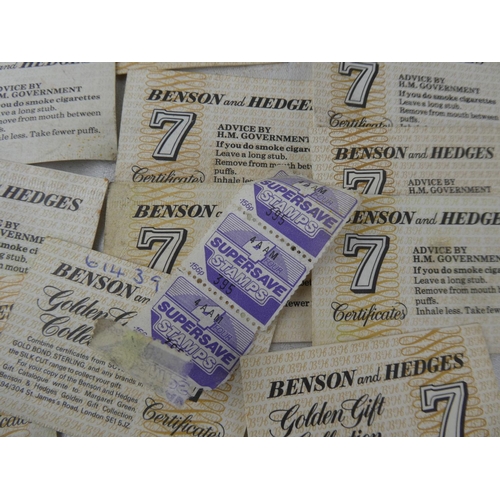 106 - A large collection of Benson and Hedges '7' certificates and four vintage Supersave stamps.