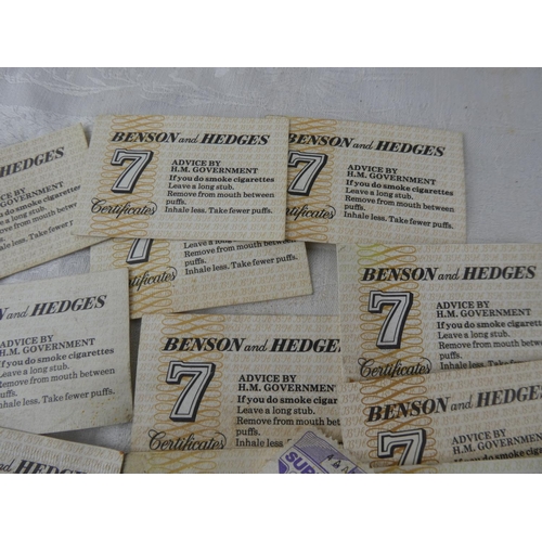 106 - A large collection of Benson and Hedges '7' certificates and four vintage Supersave stamps.