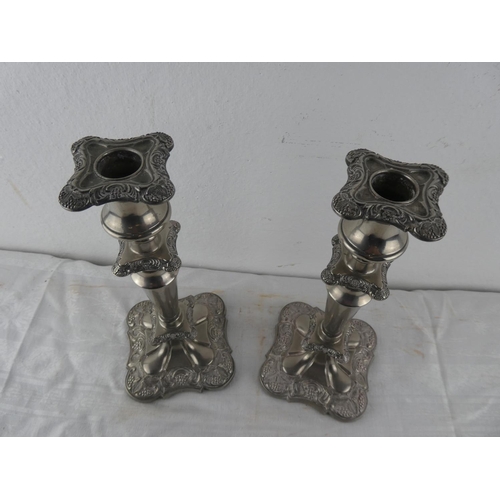 107 - A stunning pair of silver plated candlesticks.