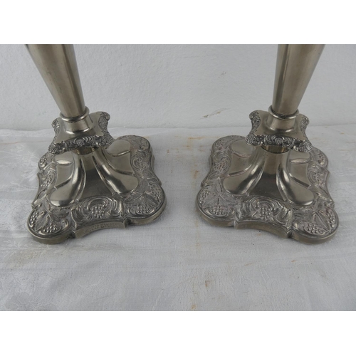 107 - A stunning pair of silver plated candlesticks.