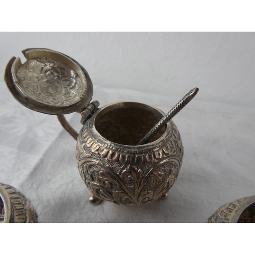 114 - A stunning antique three piece Indian Silver condiment set.