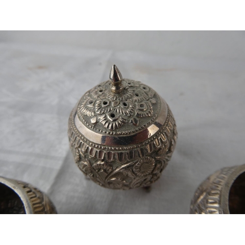 115 - A stunning antique three piece Indian Silver condiment set.