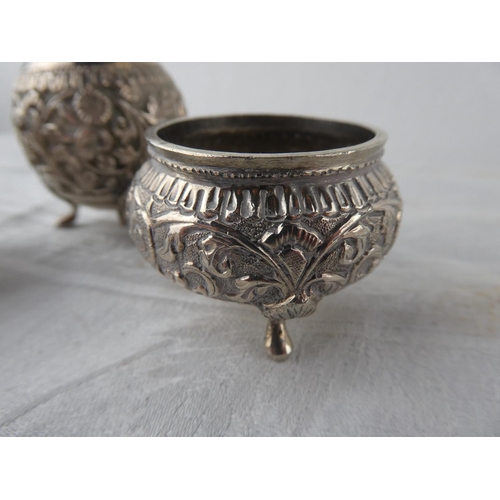 115 - A stunning antique three piece Indian Silver condiment set.