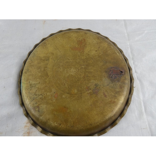 127 - A vintage brass tray with decorative design.