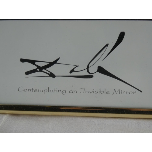 70 - A framed print, 'Contemplating on Invisible Mirror', by Salvador Dali.